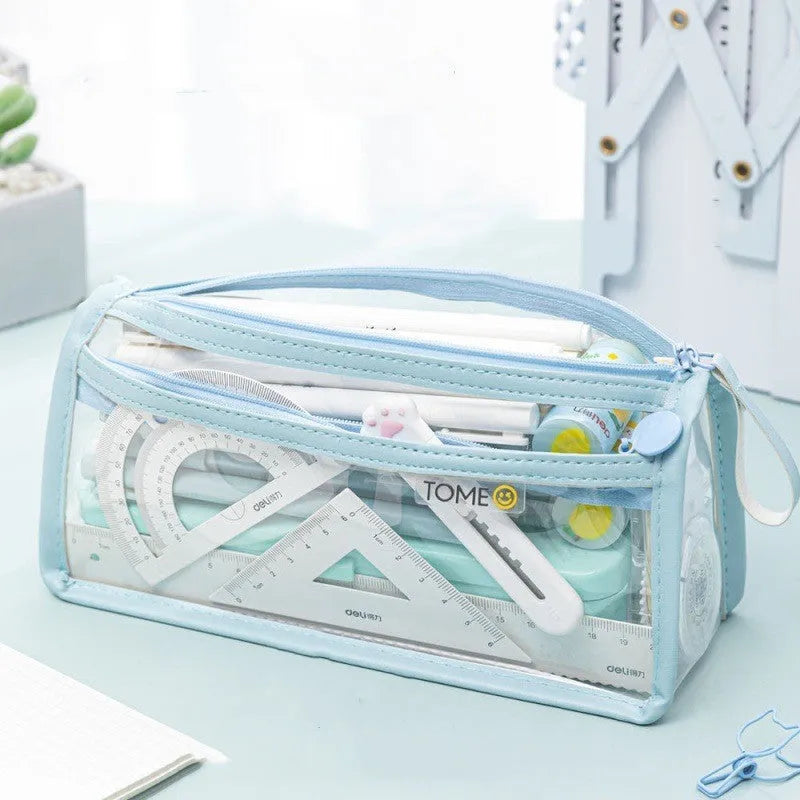 Large transparent double-layer pencil case in blue showing two compartments for exam stationery.