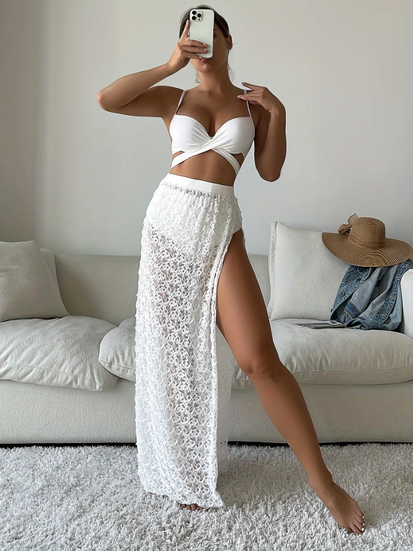 White three-piece swimsuit set with long gathered skirt, sleeveless top, and matching pants for swimming
