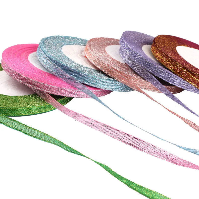 Roll of 0.6cm wide polyester gift packaging ribbon in a choice of 22 colours including gold leaf and jade pink.