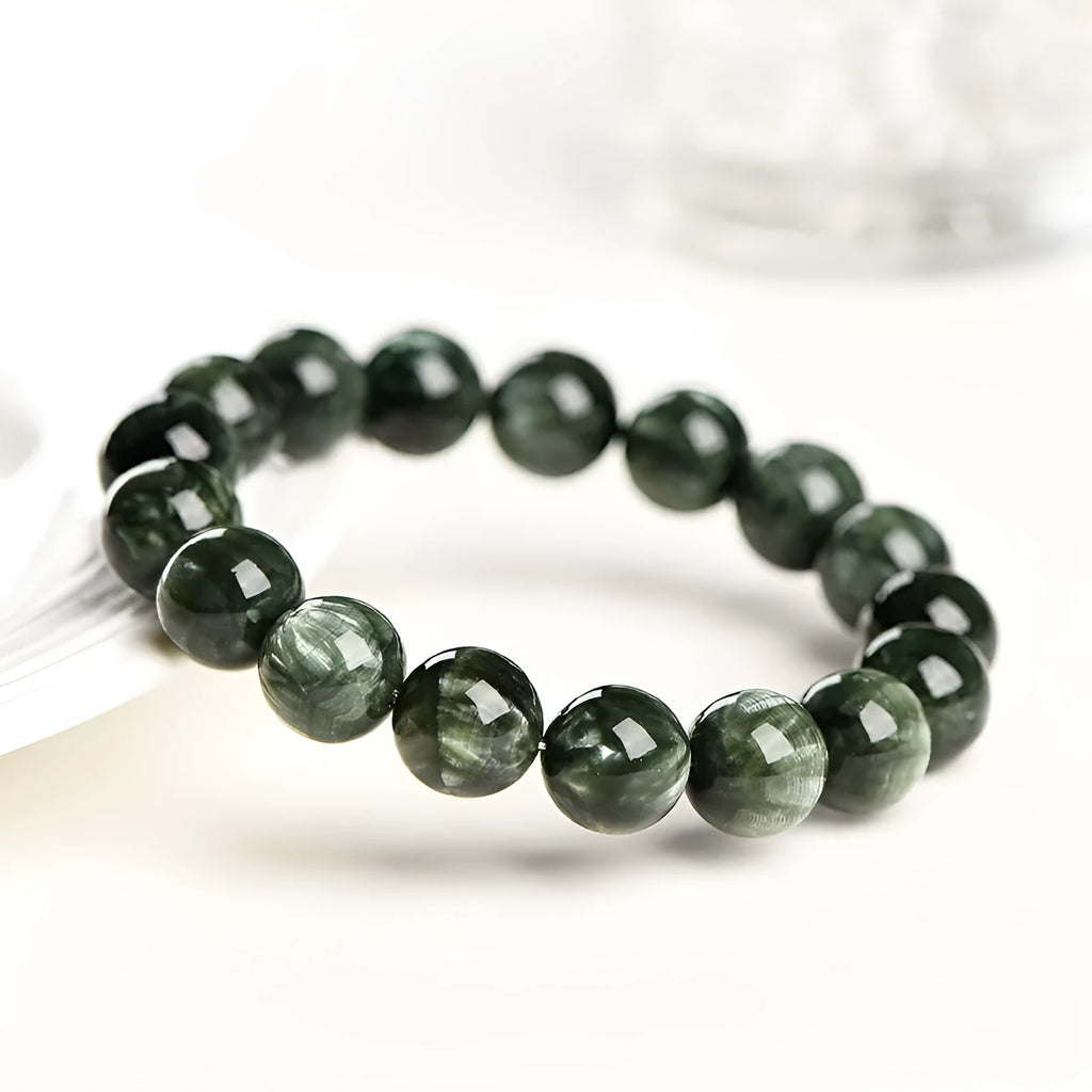 Green Dragon Crystal bracelet with 8-9mm round beads and Ruyi design element.