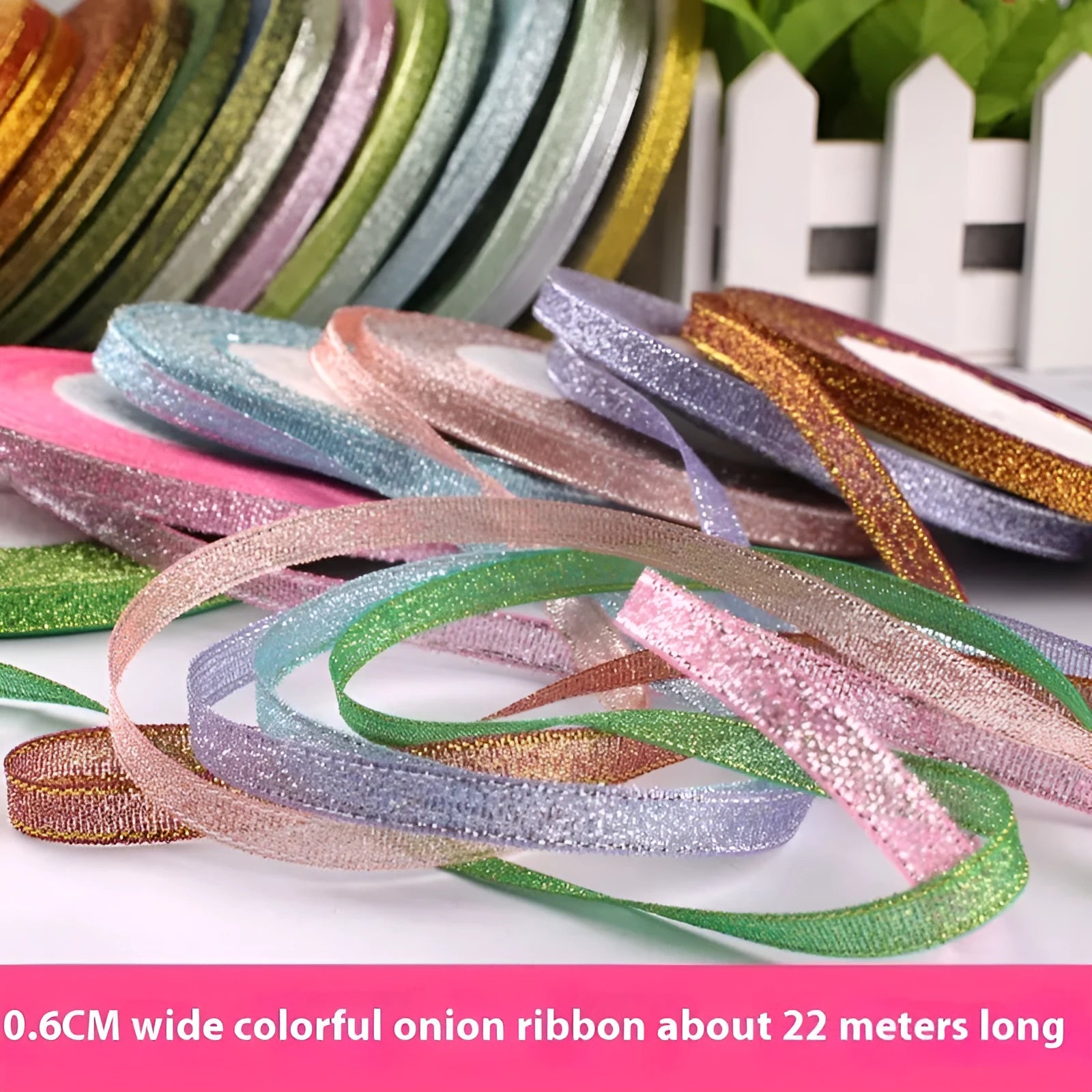 Roll of 0.6cm wide polyester gift packaging ribbon in a choice of 22 colours including gold leaf and jade pink.