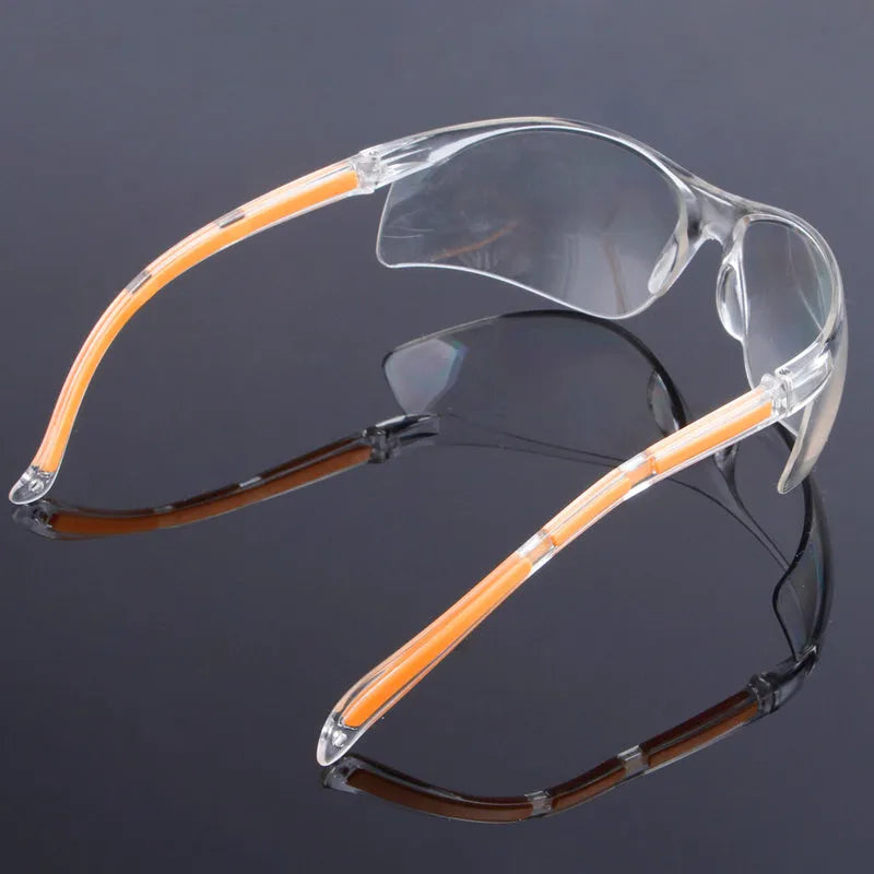 Transparent polycarbonate safety goggles with yellow lenses for eye protection.