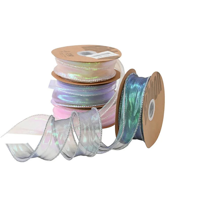 Roll of colourful fishtail yarn mesh ribbon with wave texture, shown in 4cm width.