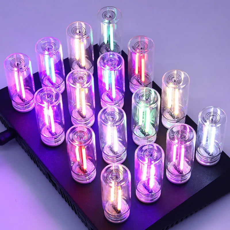 Small transparent glass USB touch night lamp in modern minimalist style.