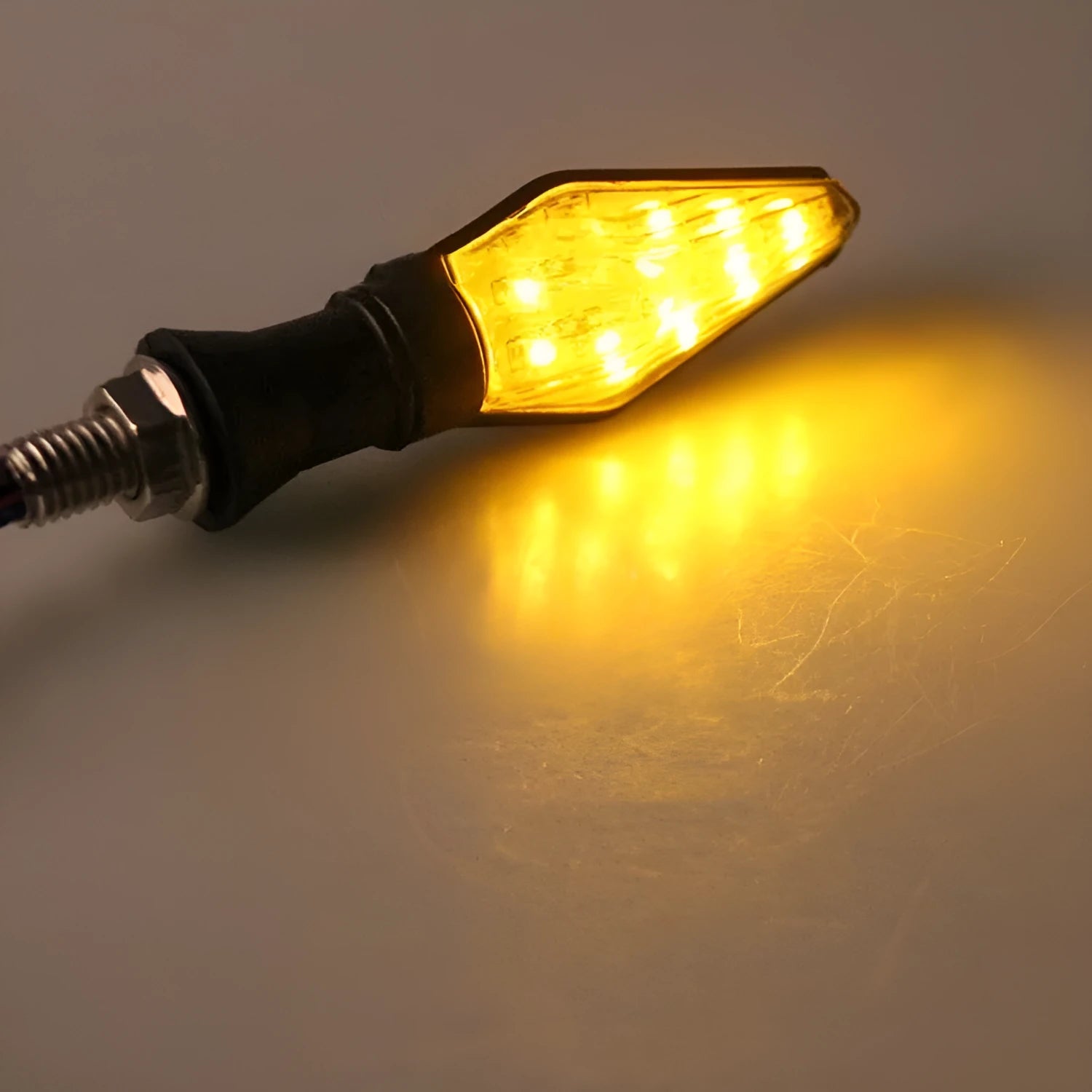 Motorcycle LED turn signal lights with double-sided luminous design showing yellow and blue lighting
