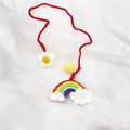Handmade crocheted avocado rainbow flower car pendant made from wool yarn.