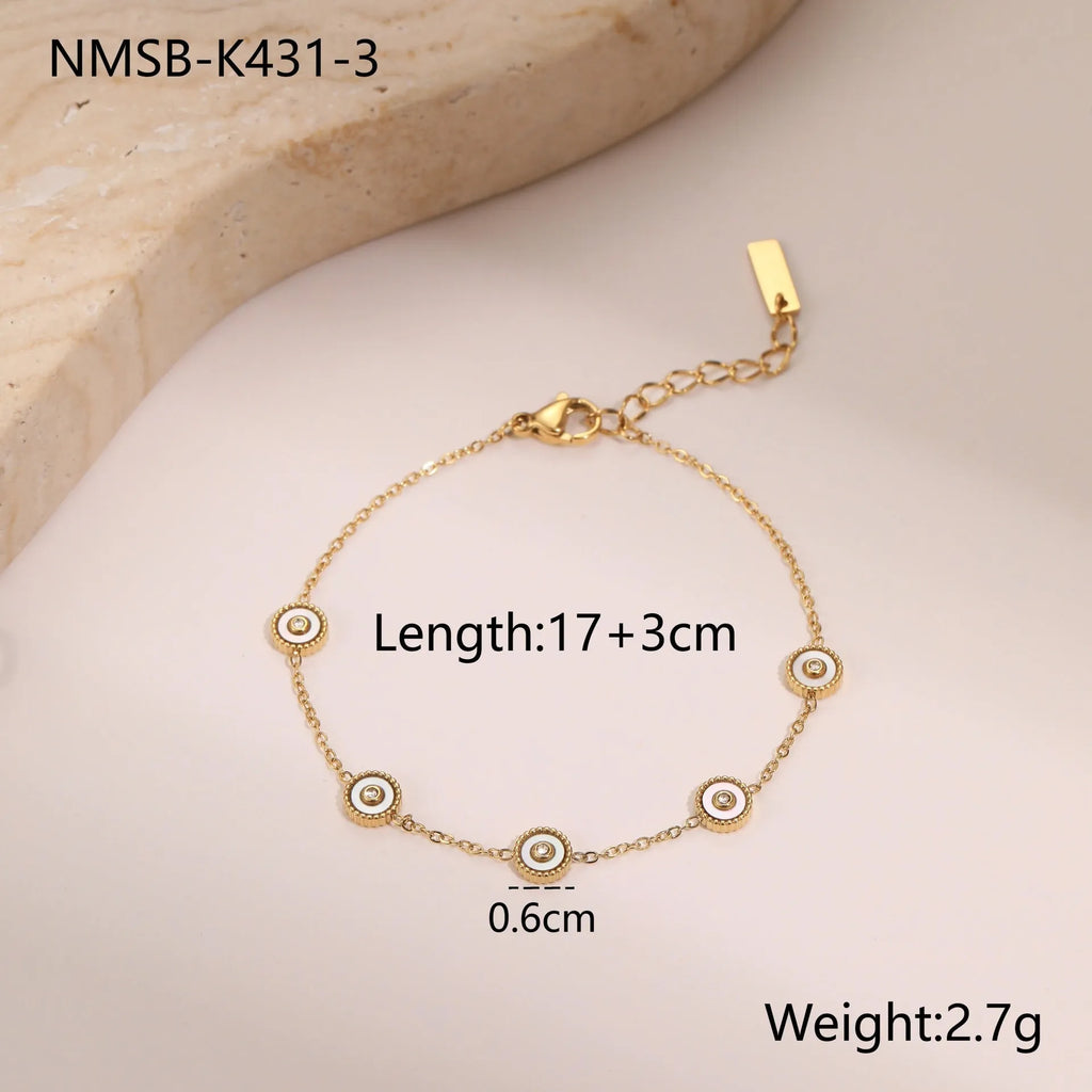 Geometric women's stainless steel bracelet with 18K gold electroplating alongside matching necklace