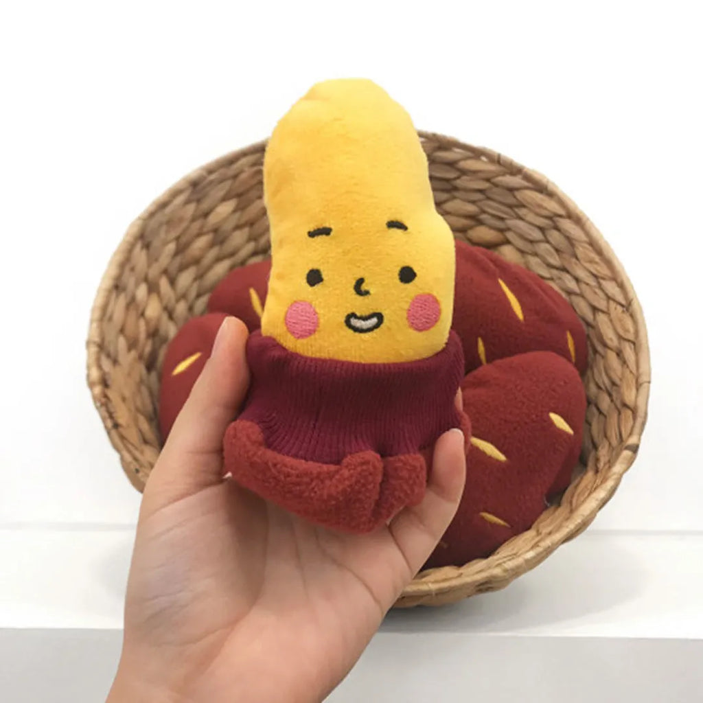 Red sweet potato pet toy with a peel-off layer and hidden treat pocket for dogs and cats.