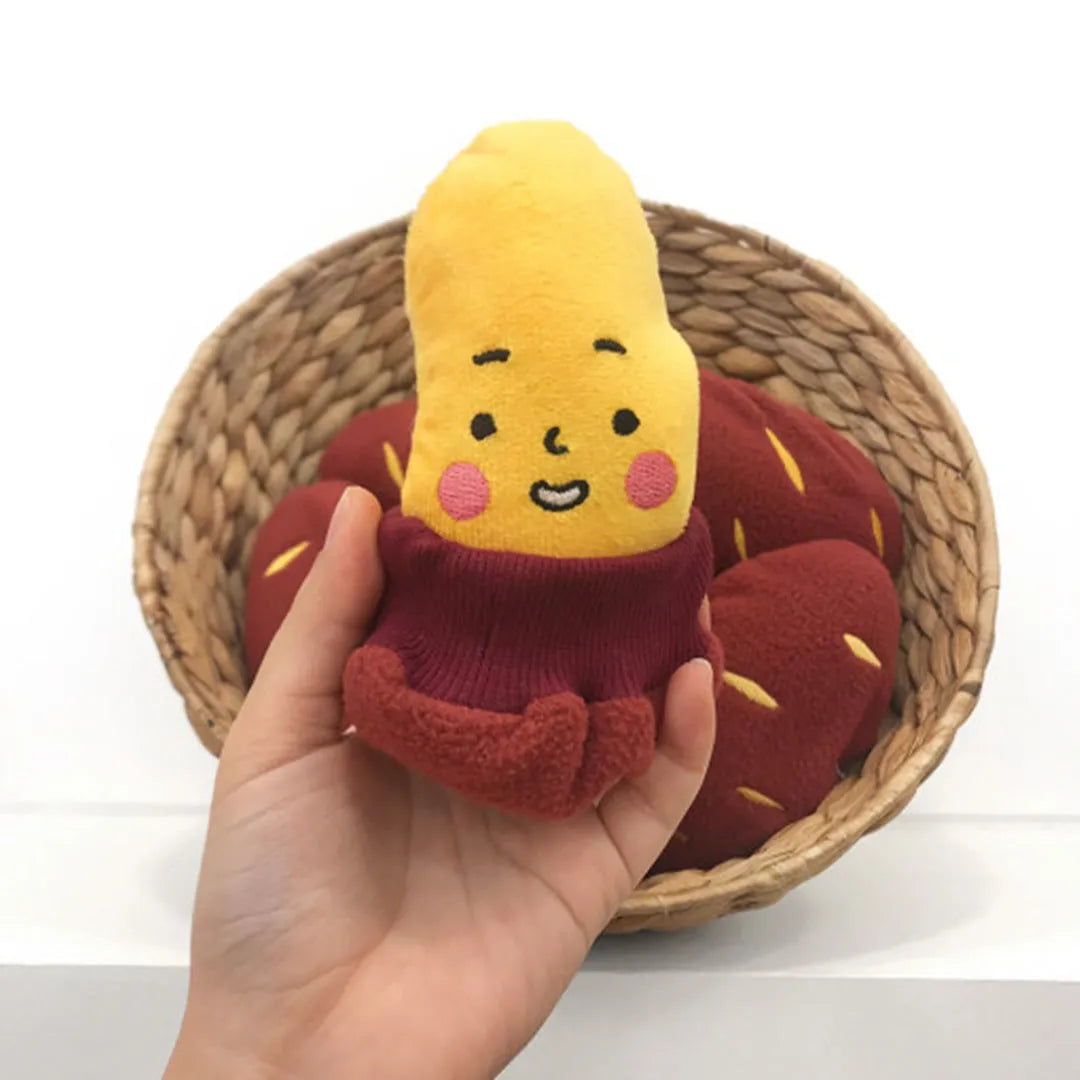 Red sweet potato pet toy with a peel-off layer and hidden treat pocket for dogs and cats.