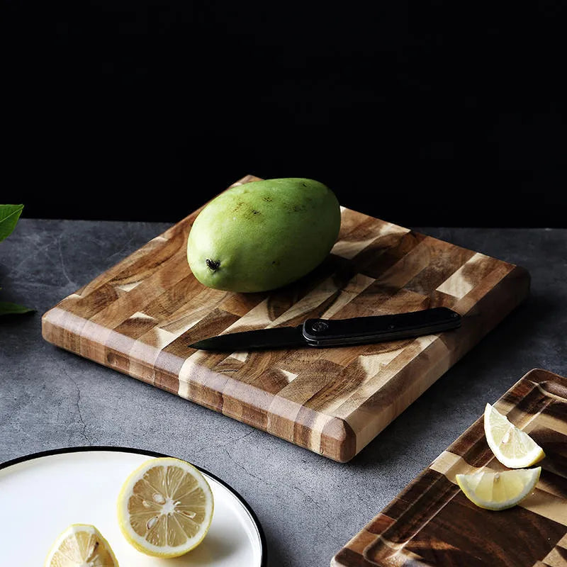 Brown solid wood cutting board with parquet pattern, 3cm thick, on kitchen counter