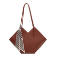 Women's large black PU shoulder bag with square shape and top handle on a neutral background
