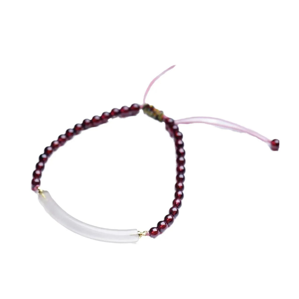 Adjustable red garnet and agate beaded bracelet with pull bead closure on wrist