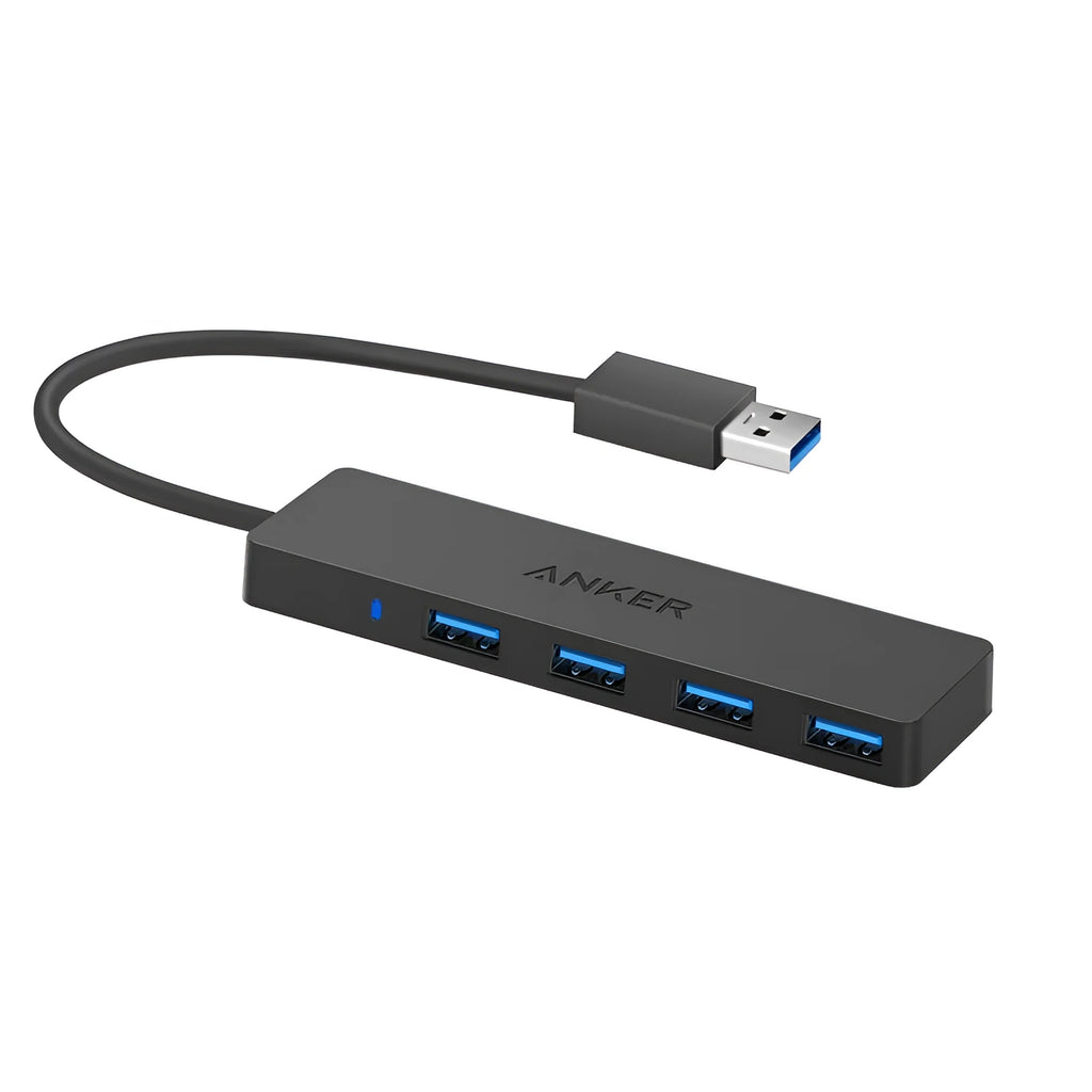 Black Anker 4-port USB 3.0 hub with short attached cable on a desk.