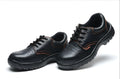 Black antiskid safety work shoes with steel toe, embossed cowhide upper, on a white background