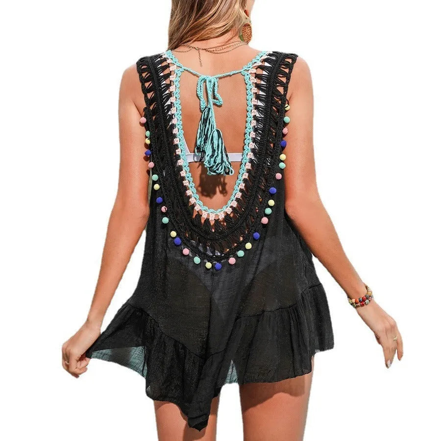Black women's crochet beach cover-up with cut-out details and ruffles