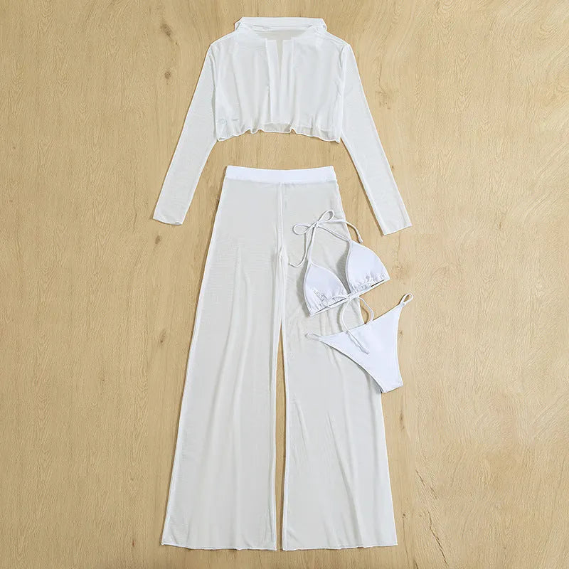 White women's four-piece swimsuit set showing top, high-waist trousers, bra, and panties arranged flat