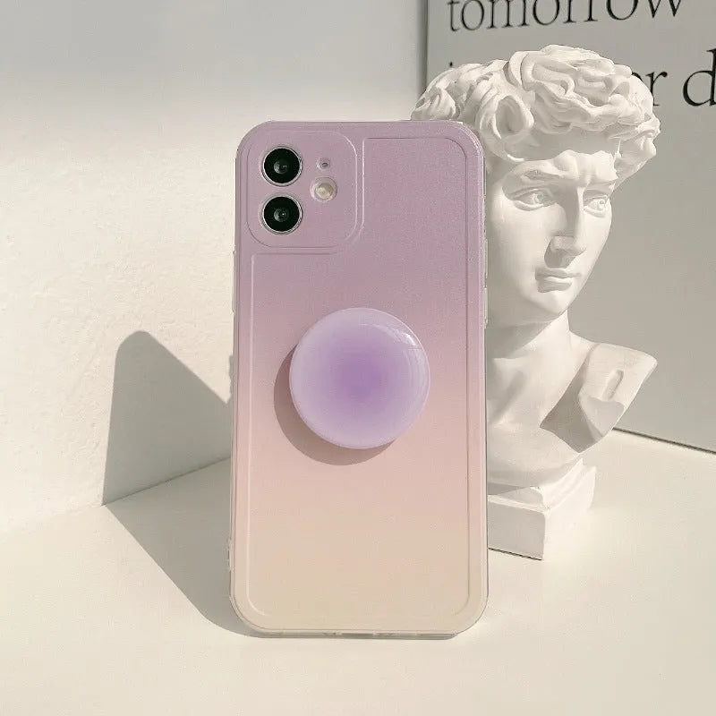 Yellow and purple gradient silicone iPhone case with a retractable viewing stand extended.