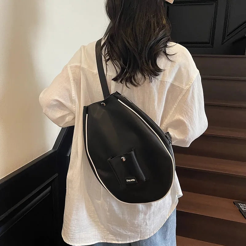 Casual one-shoulder yoga storage bag in black with 36-55L capacity and breathable lining