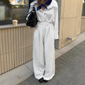 White striped wide-leg commuting trousers with zipper closure on mannequin