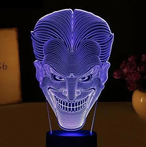 USB-powered 3D LED lamp showing multiple colours on an acrylic panel with a remote control.