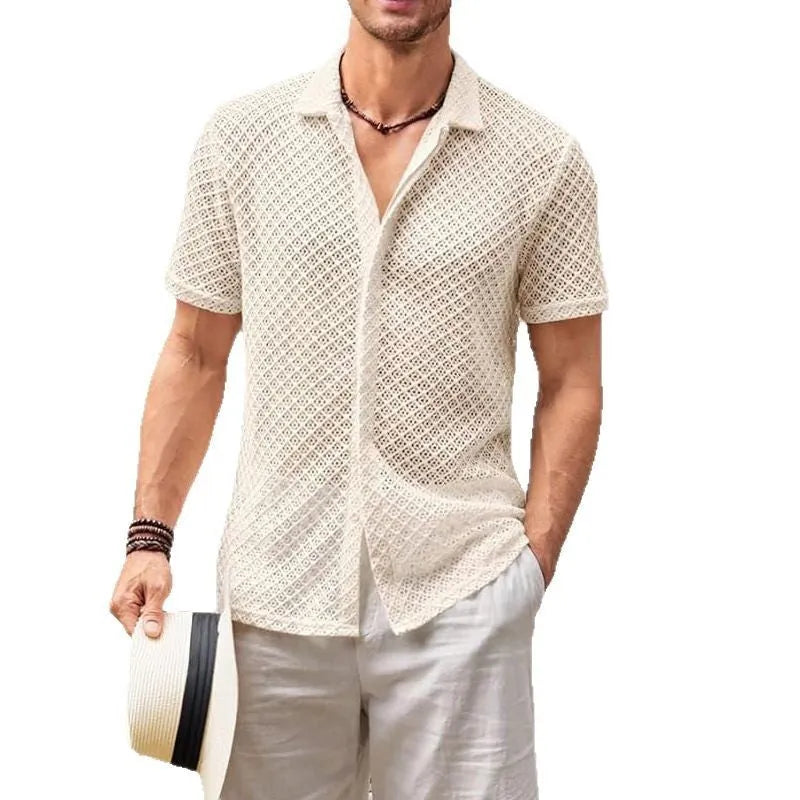 Man wearing a beige loose-fit short sleeve mesh lapel shirt on a beach.