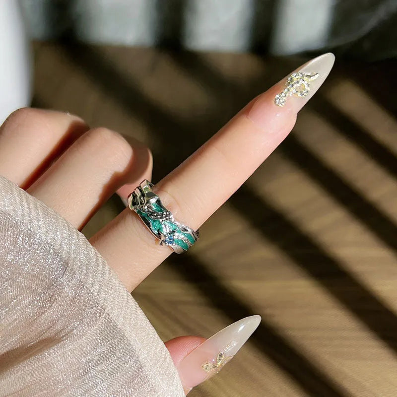 Mint green enamel astrology star ring with asymmetrical folded design on copper base