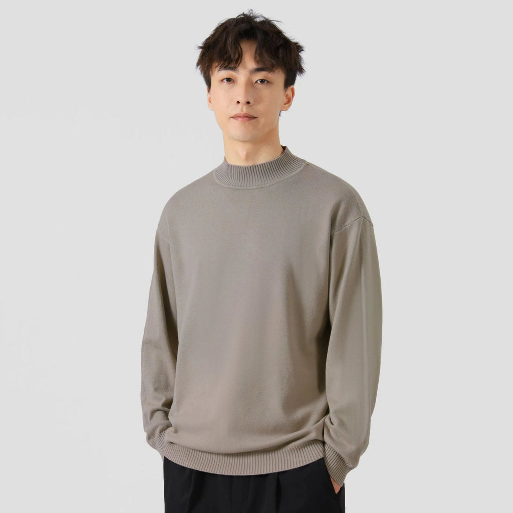 Men's loose fit long sleeve casual jumper in army green colour on a hanger.