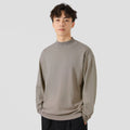 Men's loose fit long sleeve casual jumper in army green colour on a hanger.