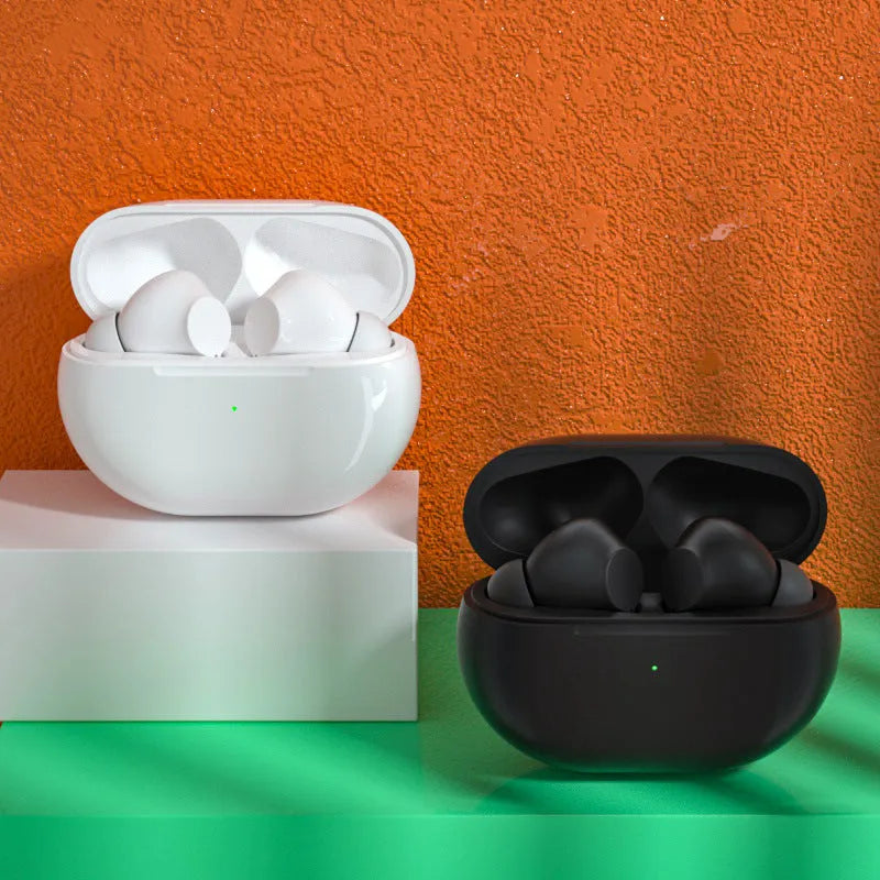 Black and white Pro4 Bluetooth wireless earbuds with their compact charging case on a table.