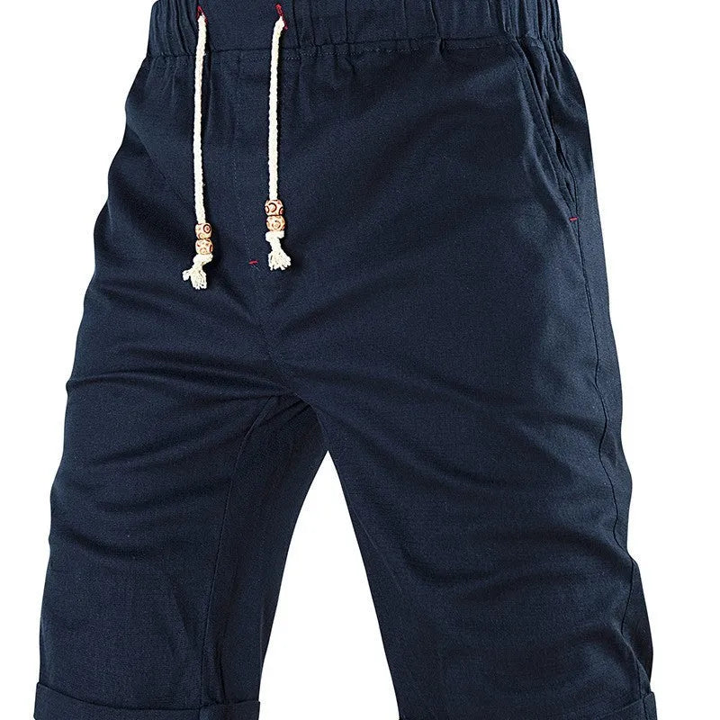 Men's solid-colour cotton-blend casual shorts with a drawstring waist and zipper pocket.