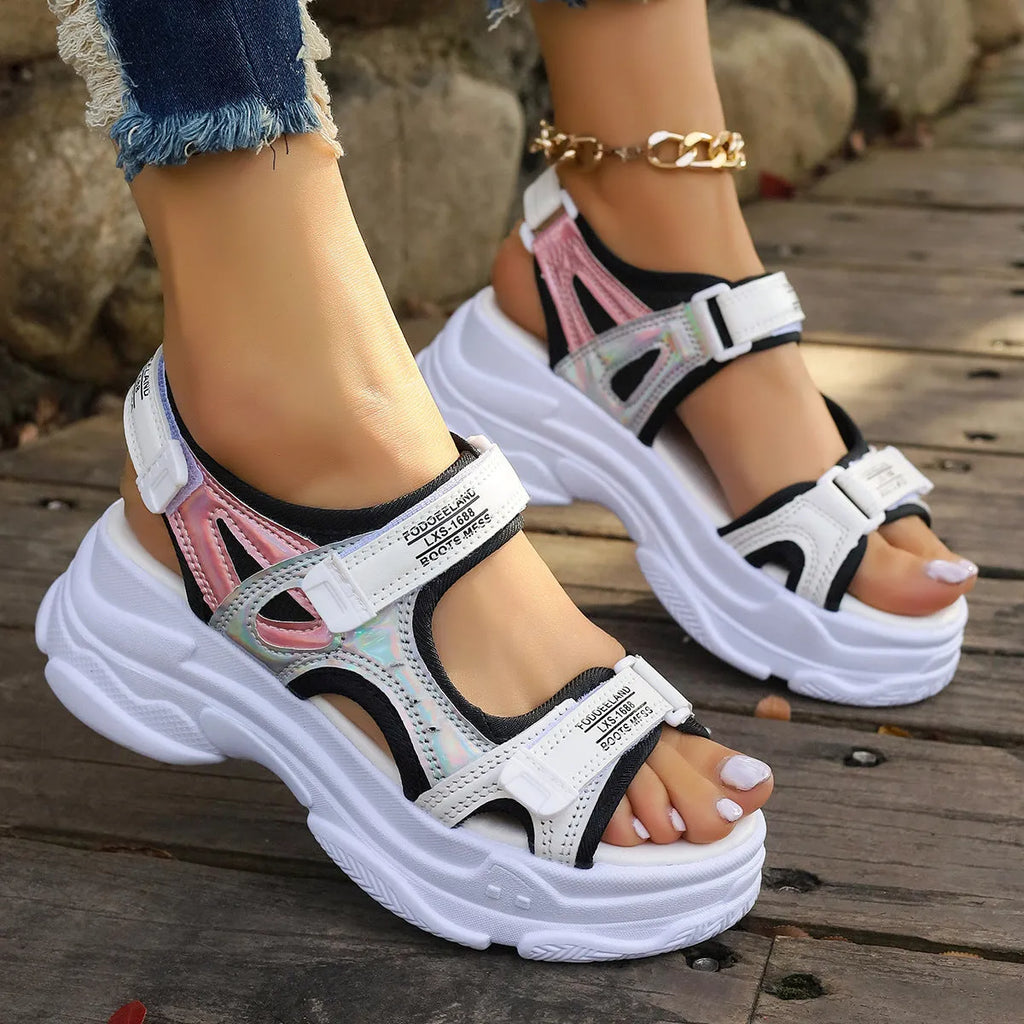 Women's black Roman platform sandals with adjustable straps and rubber soles
