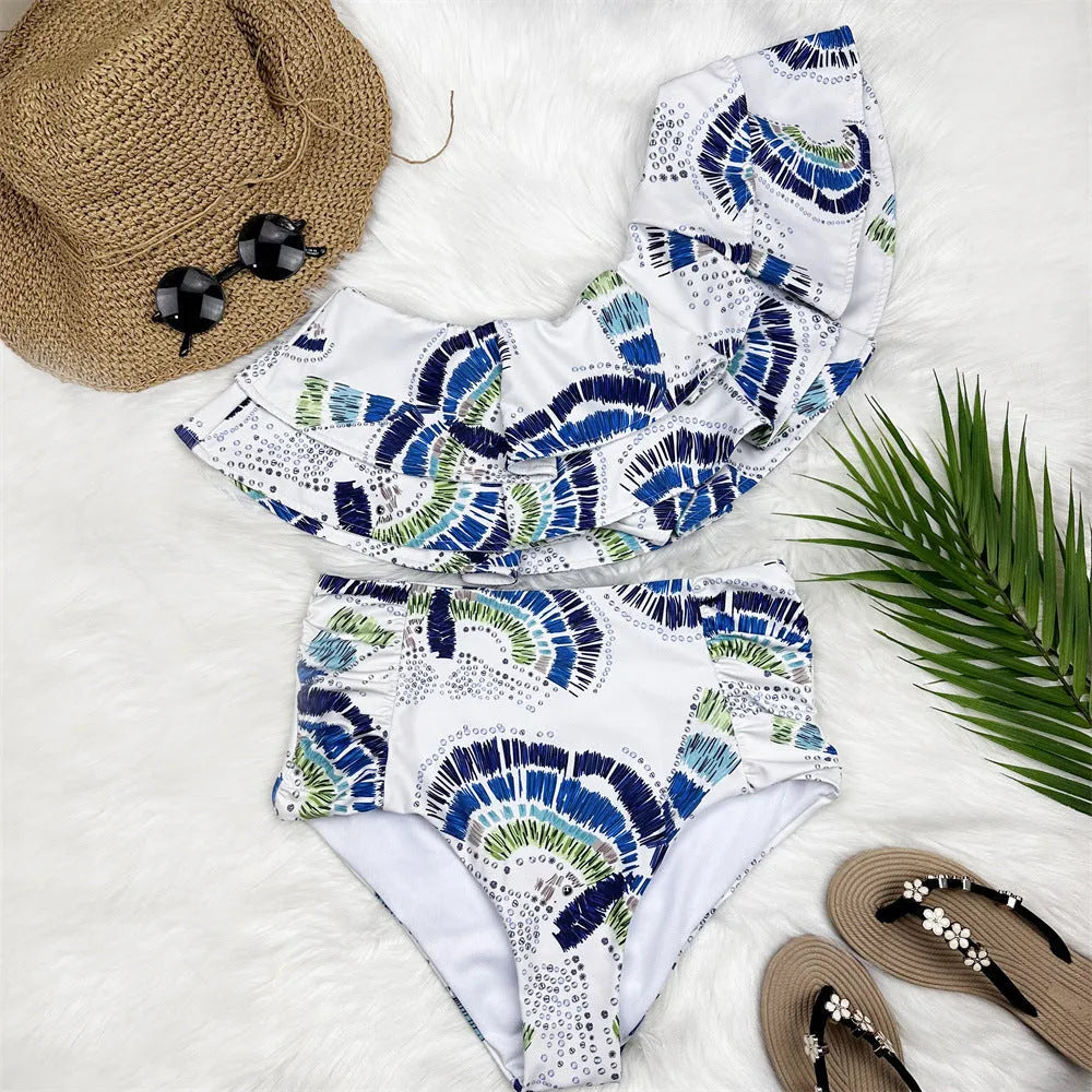 White one-shoulder women's swimsuit with large lotus leaf detail and high-leg split.