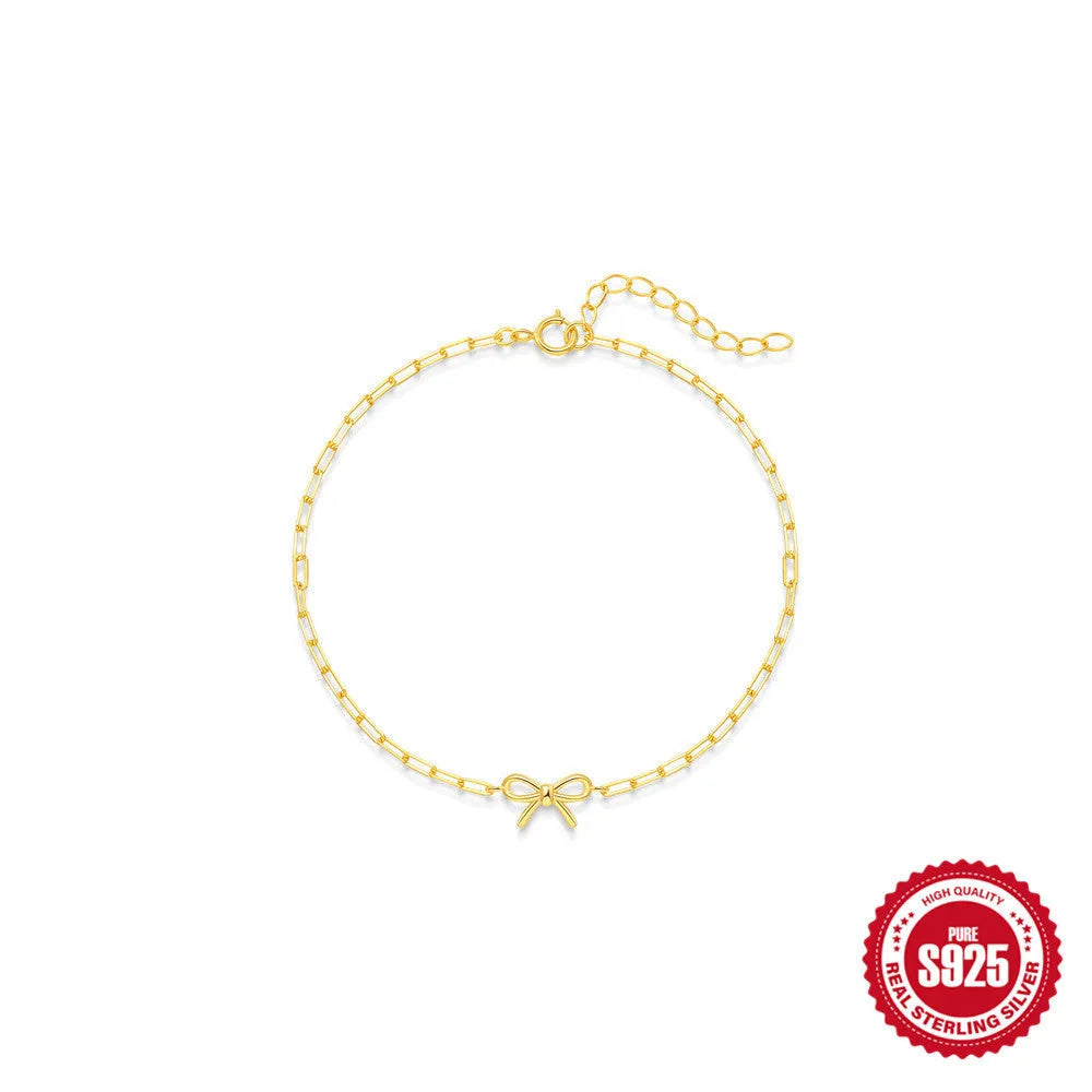 S925 sterling silver bracelet with geometric heart charm and clip chain fastening in gold plating