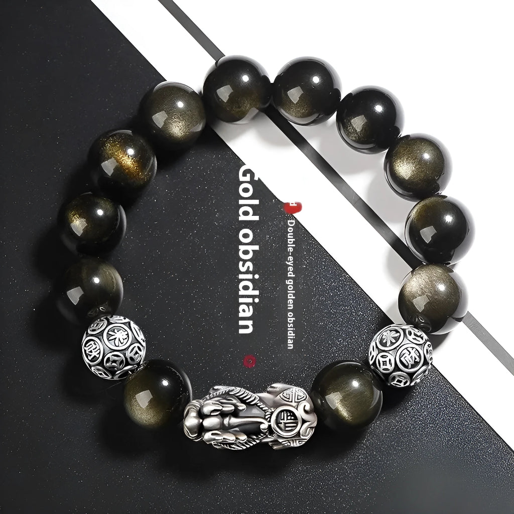 Men's geometric bracelet with a polished obsidian bead and 999 sterling silver on a leather strap.