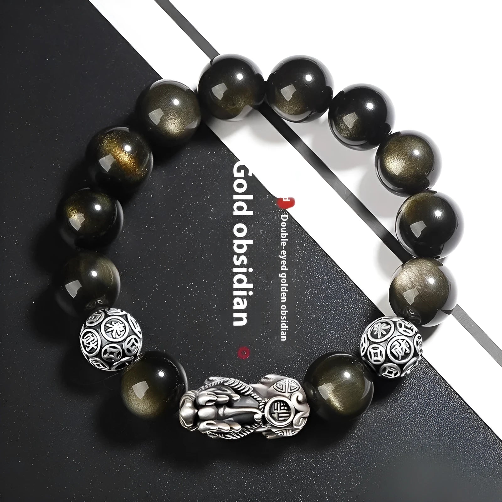 Men's geometric bracelet with a polished obsidian bead and 999 sterling silver on a leather strap.