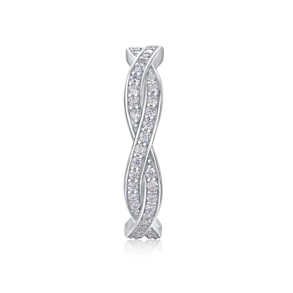 Moissanite wedding ring set in S925 silver with platinum plating on a white background