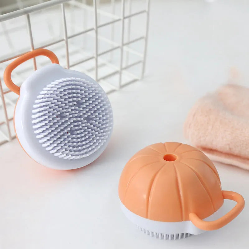 Orange silicone dog bath brush with shampoo dispenser and massage bristles for pet grooming