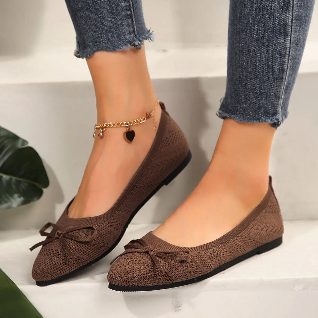 Women's knitted flat shoes with a pointed toe and decorative bow, shown in multiple colour options.