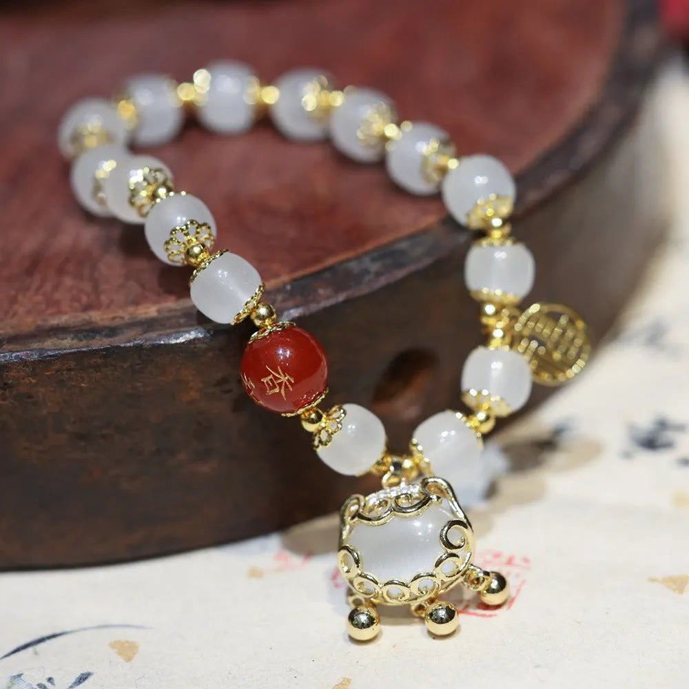Chinese style women's coloured glaze bracelet with safety lock, windmill and bamboo charms