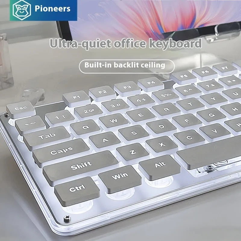 Button Mute wired mechanical keyboard with backlit keys on a desk, showing colour options.