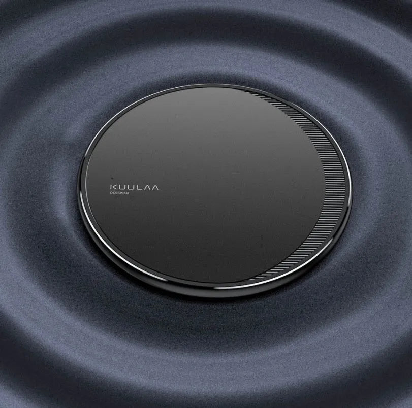Black Kuulaa KL-CD16 wireless charging disc for mobile phones on a surface