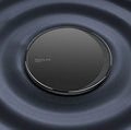 Black Kuulaa KL-CD16 wireless charging disc for mobile phones on a surface