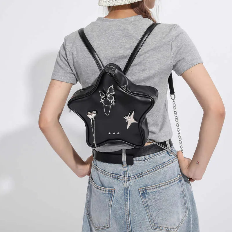 Women's soft PU messenger bag mini backpack in black with adjustable shoulder strap for cross-body or single shoulder wear
