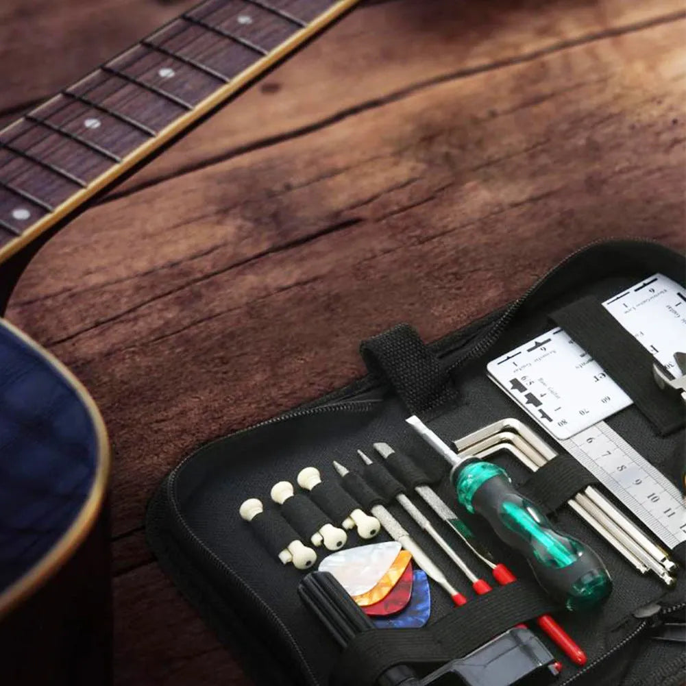 Black plastic and metal guitar repair tool kit for guitar, bass, mandolin, and banjo maintenance