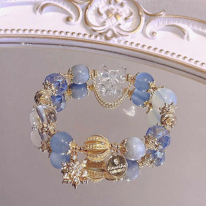 Women's sweet style galaxy colour alloy bracelet with snowflake pendant, heart, bow and cartoon character charms.
