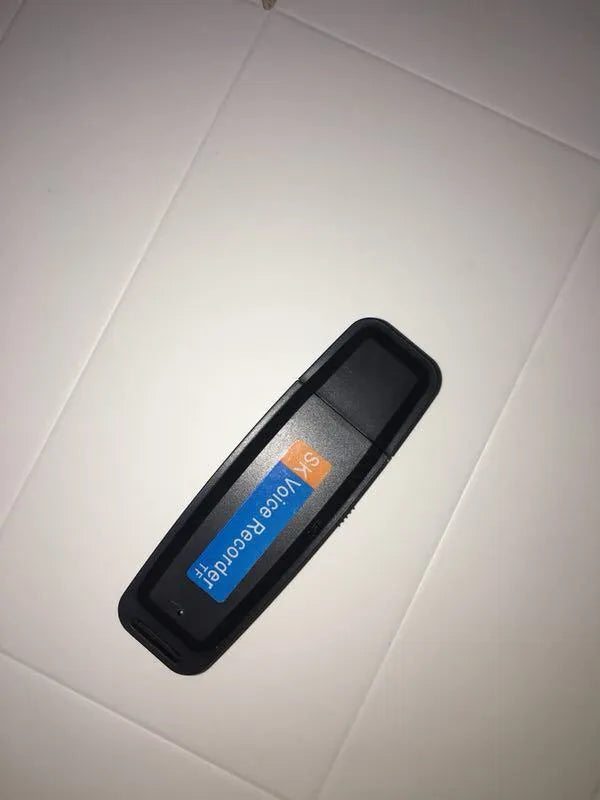 SK-001 black and white creative USB flash drive with plastic casing on a white background.
