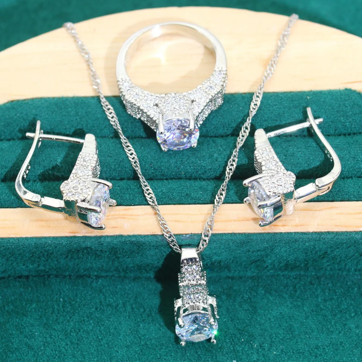 Four-piece bridal jewellery set with zircon chain necklace, bracelet, earrings and ring in alloy with water wave design