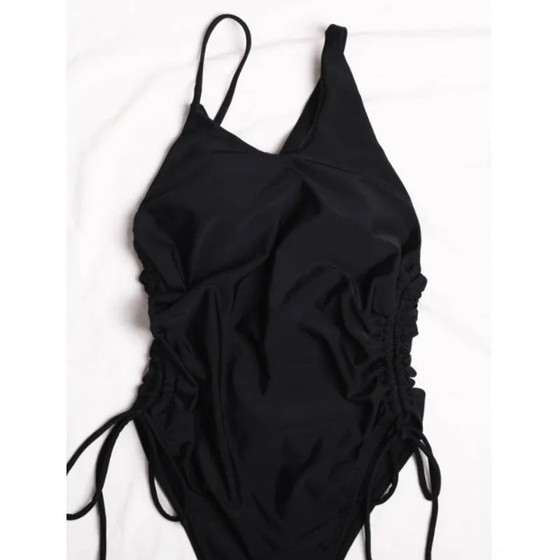 Black women's dress with sloping shoulder design and tight-fitting sleeveless cut