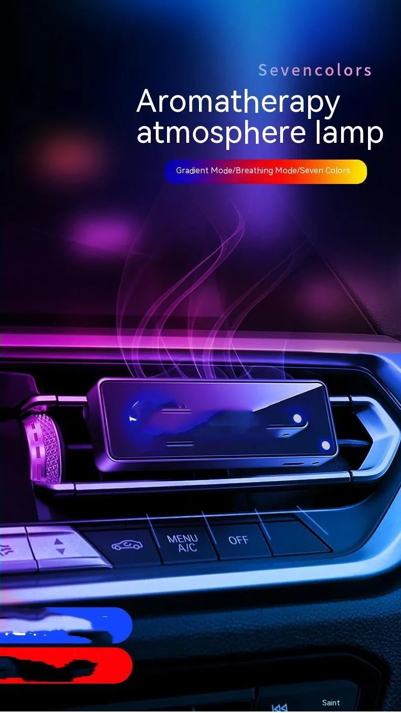 Black car air vent perfume diffuser with LED lighting mounted on vehicle dashboard