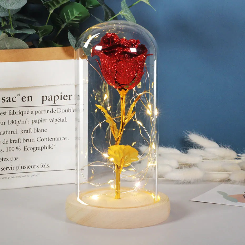 Handmade eternal red rose flower with warm white LED light inside a glass cover